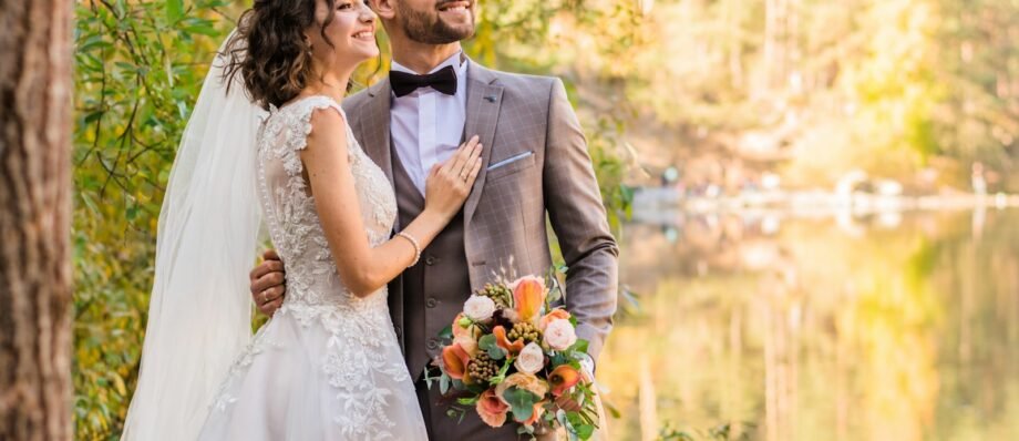 man in gray suit and woman in white wedding dress