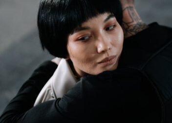 A poignant embrace depicting emotional connection and unity between two people.