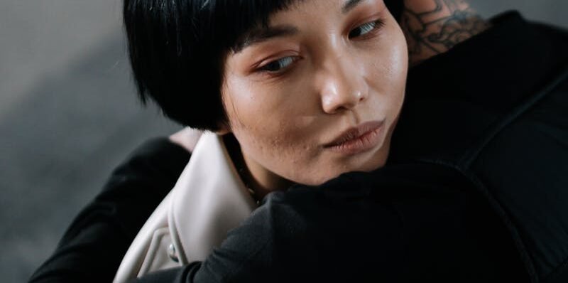 A poignant embrace depicting emotional connection and unity between two people.