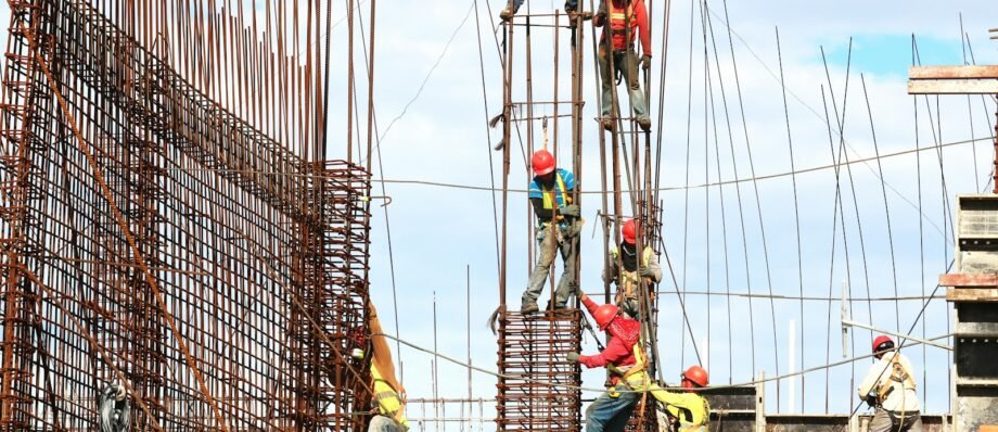 people working on building during daytime