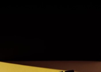 Word 'UPDATE' casting shadow on yellow background. Creative typography concept.